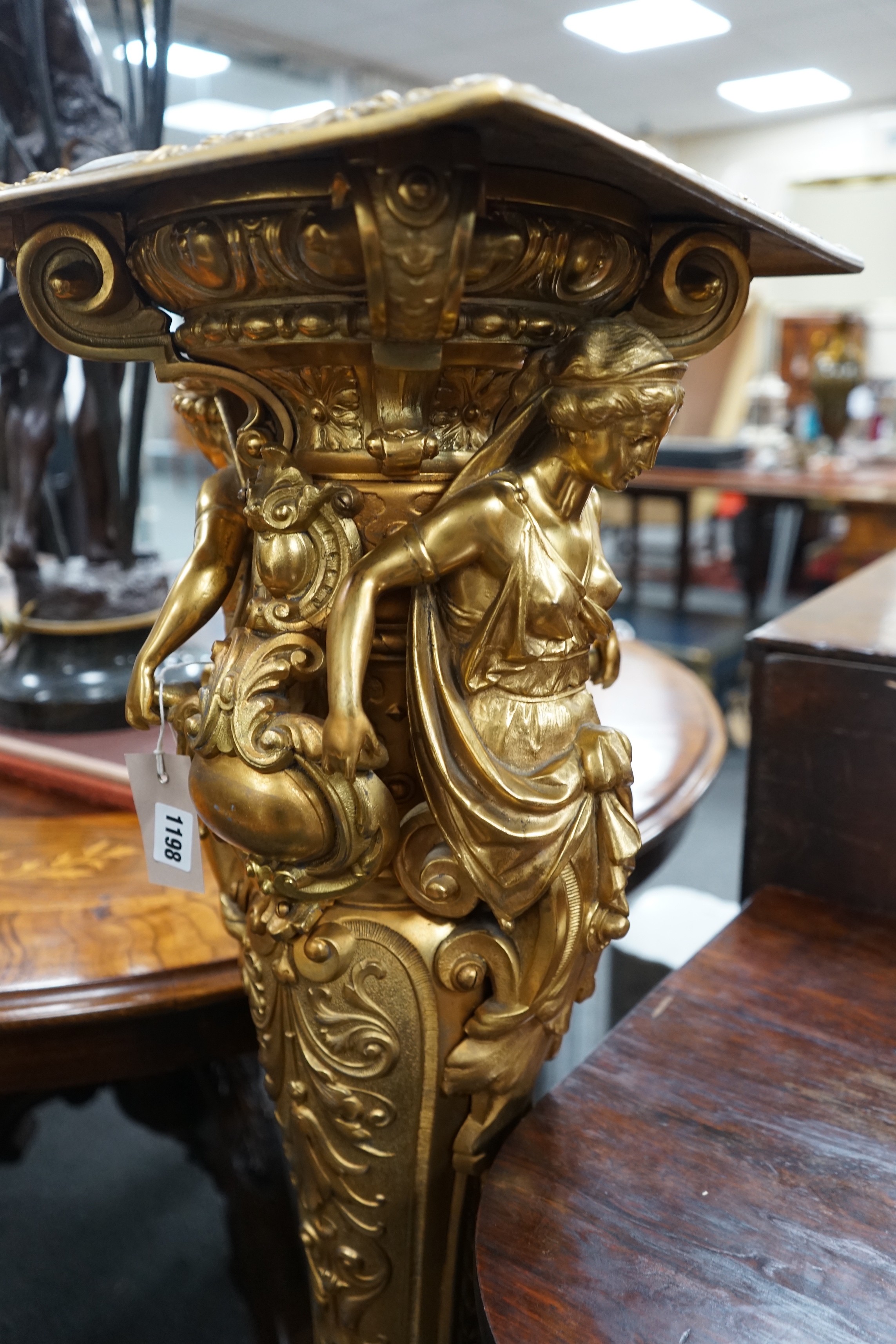 A Neo Classical style gilt spelter pedestal, cast with female busts and oval cartouche, height 115cm